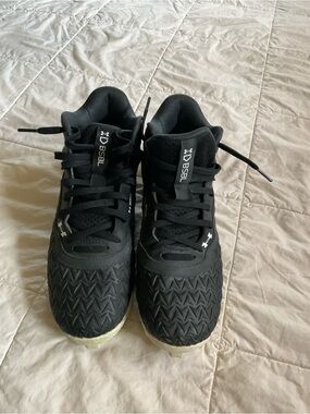 Big boys Under Armour footballs Cleats